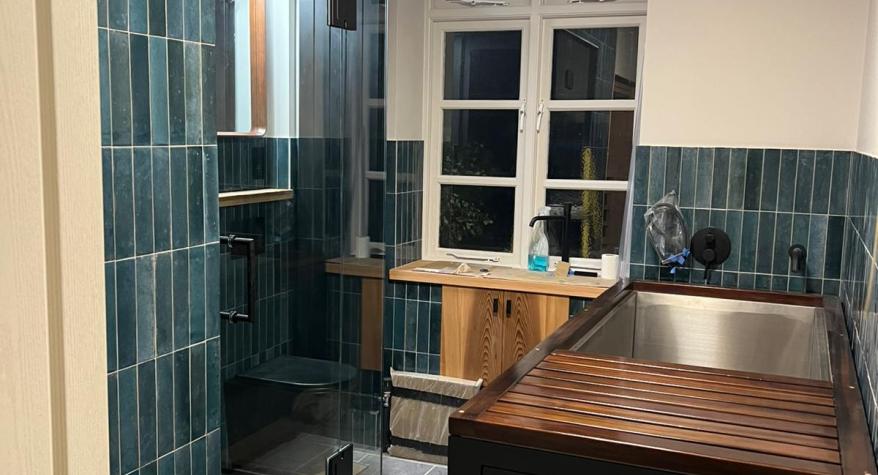 Steam room installation with wired sauna, steam unit & plunge bath